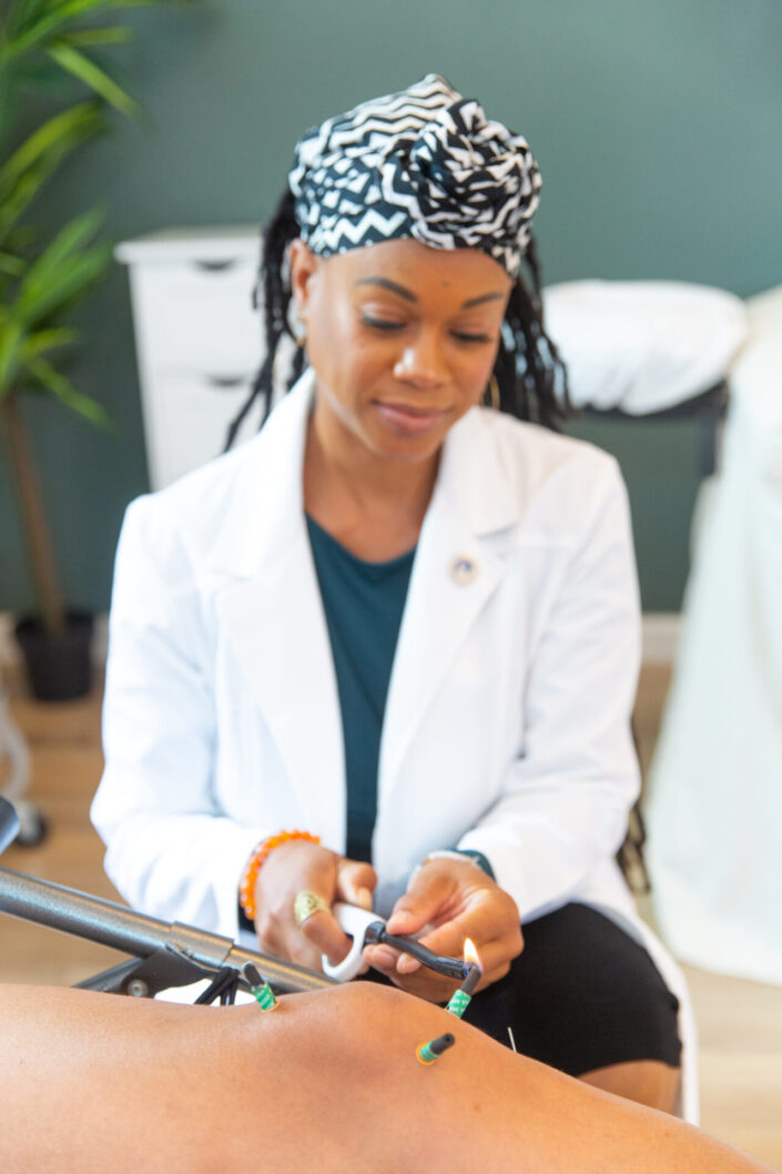 Acupuncturist working on a patient