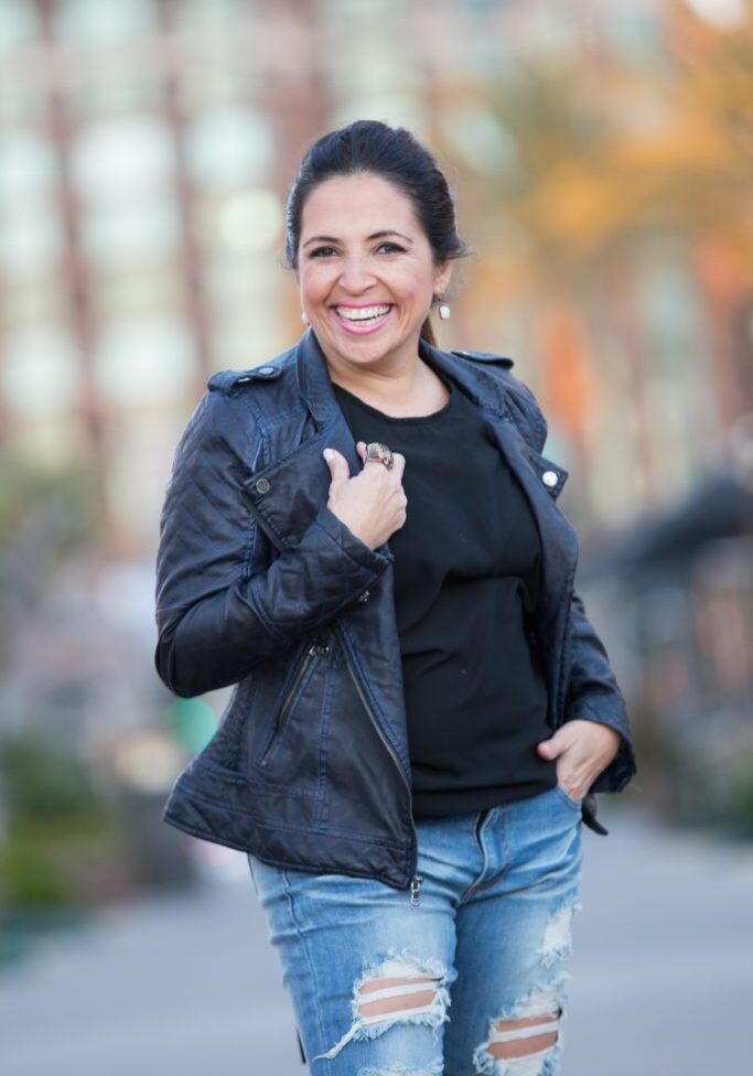 lady smiling and wearing a black jacket