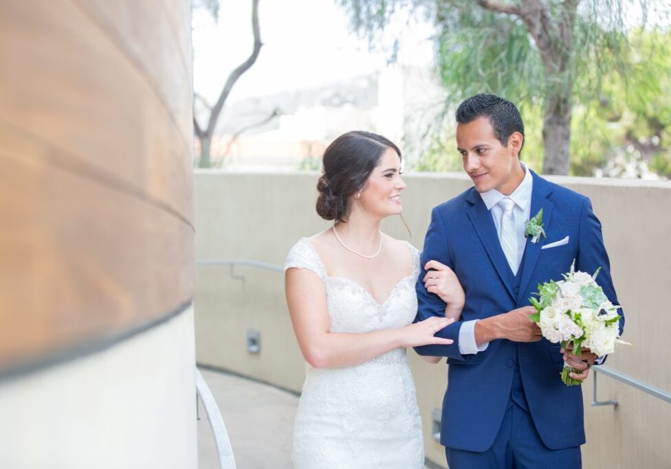 Bride and groom smiling at each other