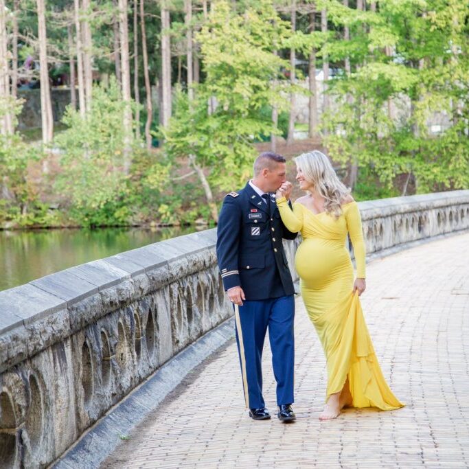 couple standing on a bridge