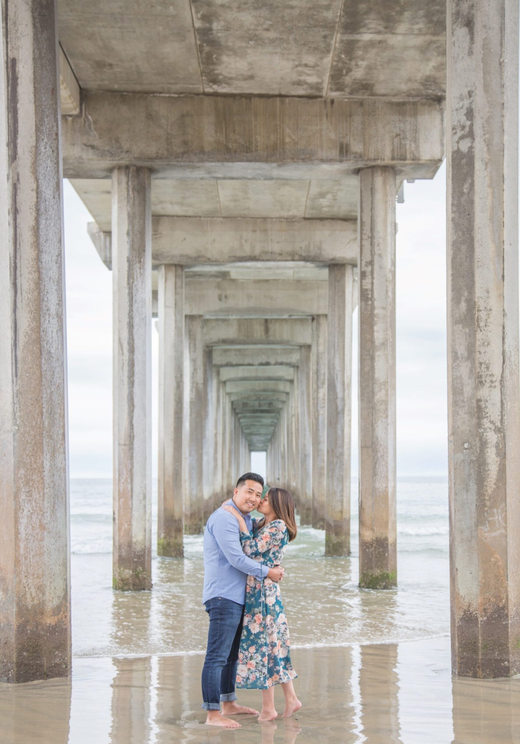 engagement photo of a couple on a beach